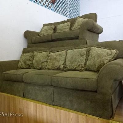 Matching green couch and love seat