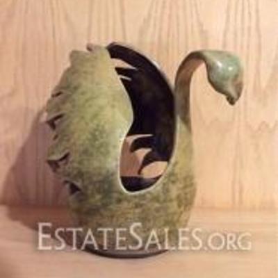 
036: Christopher Mathie Raku Swan 

Mustard and algae green colored Raku swan with cut out detailing, 9 H x 6 W x 9.5 D inches, signed...
