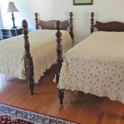 Antique walnut twin beds with custom made crocheted bedcovers.