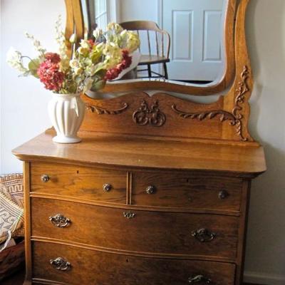 Antique oak dresser with mirror, part of a three piece ensemble.