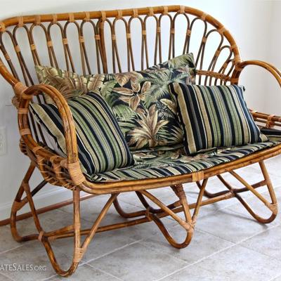 Franco Albini style rattan settee with custom upholstery and pillows.