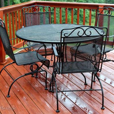 Metal patio table with four chairs