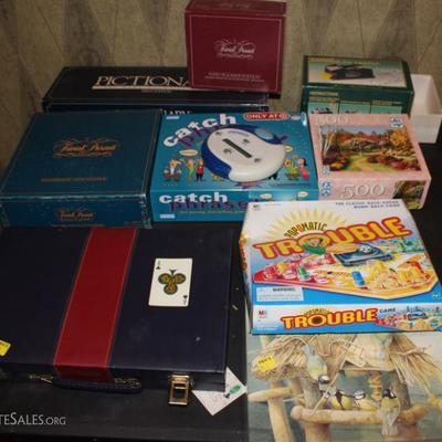 Box lot of games and puzzles
