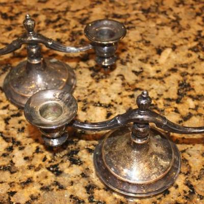 A pair of silver plate candle stick holders 
