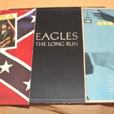 Three vinyl records Alabama, The Eagles, and Strau
