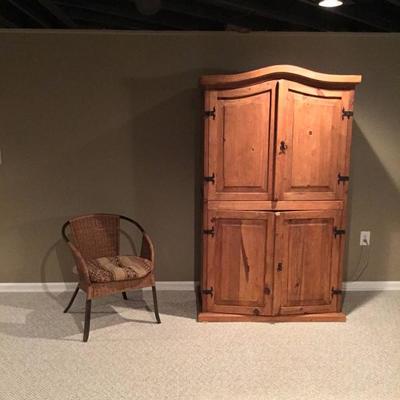 Armoire and wicker chair