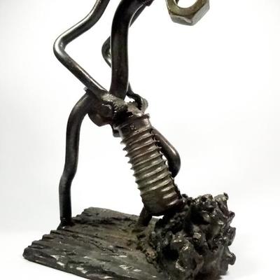 STEAMPUNK SCULPTURE FASHIONED FROM NUTS AND BOLTS, MAN WITH JACKHAMMER