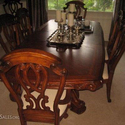 Dining room table by AICO . Eight dining room chairs, table and china cabinet. All pieces $1250