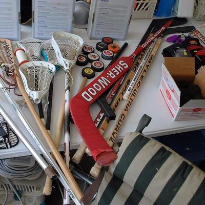 Lacrosse Sticks; Hockey Sticks, Pucks, and Other Gear; Baseball Mitts and Bats; Tennis Rackets and Cases; Roller Blades; Misc. Balls...