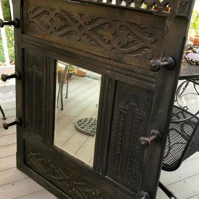 Antique carve wall rack with mirror and 6 pegs to hang your hats and clothes
