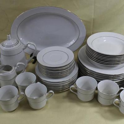 Service for eight by Royal Majestic, Fine China D'  OR with teapot, cream and sugar, dinner plates,  bowls, cups and saucers, salad...