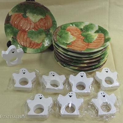 Eight plates with pumpkin motif and eight ghost  shape napkin rings.  Plates are 7.5