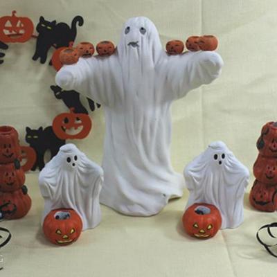 Box lot of Halloween dÃ©cor. Three ghost, two   pumpkin candle holders, one wreath, six candle  sticks. Large ghost is 11