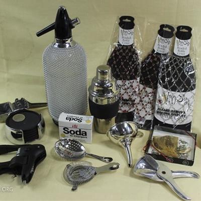Bar set includes soda seltzer, champagne bottle  stopper, shaker, wine oxidizer, stemware charms,  three beaded bottle cover
