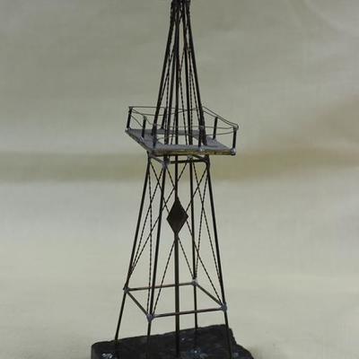 Oil rig sculpture on granite base 10" H X  2.5" W  X 3"D
