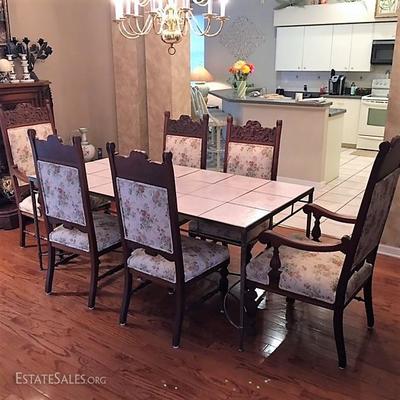 Contemporary tile top dining table with period American Victorian dining chairs 