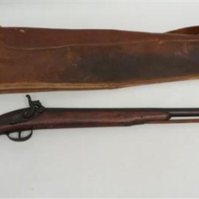 Antique 19th c. Percussion Rifle and Leather Case. There are no markings on the small bore rifle except for a very worn Manufactured in...