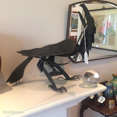 A signed modern metal sculpture of a raven