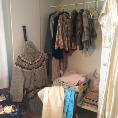 Handmade wool sweater and several examples of fur shawls