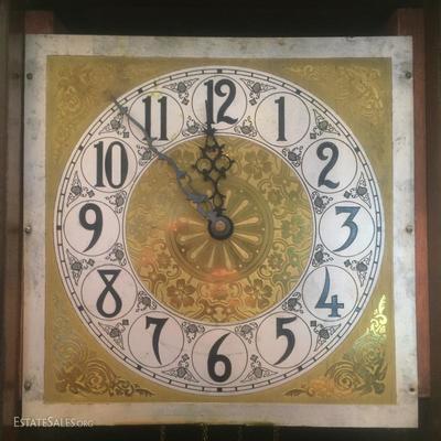 Gilt dial and arabesque numbers of the grandfather clock