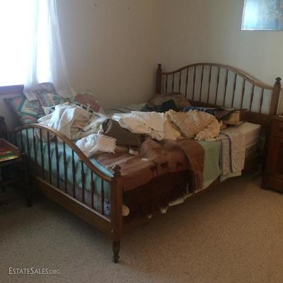 Nice Queen size bed w/ spindle head and footboards. Includes box spring and mattress. Many hand-made throw pillows.