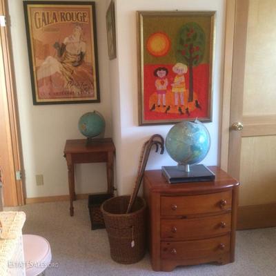 Two globes, one which lights up. Also a handsewn wall decoration and an old French poster (reproduction) in a frame