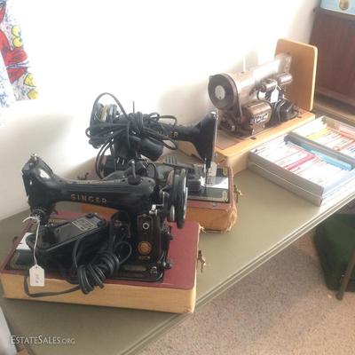  Five old sewing machine's, including three made by Singer, one by Spartan and one by Elna. 