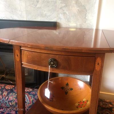 Close up of Federal style drop leaf and table showing marquetry inlay detail. Hand-painted wooden bowl underneath.