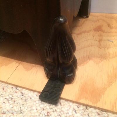 Curved feet of the grandfather clock