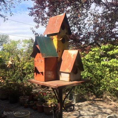 Free standing tall metal birdhouse with planter rings