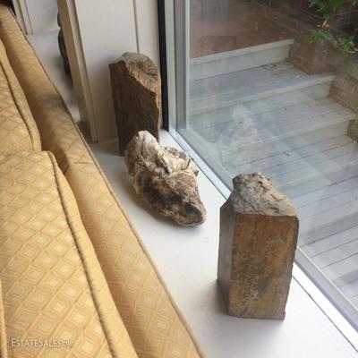 A pair of petrified wood bookends and another specimen of petrified wood