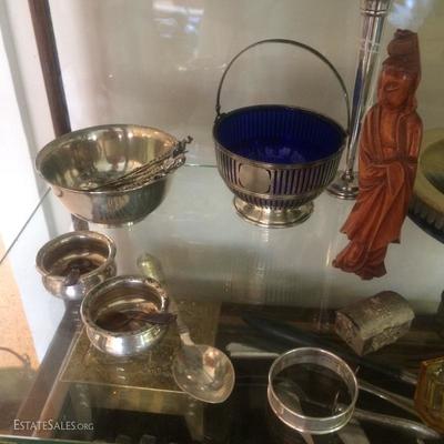  Hand hammered small sterling silver bowl, two Sterling salt cellars, a George Jensen Sterling spoon, a sterling silver napkin ring, etc.