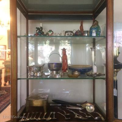 Direction of sterling silver, a piece of Fulper pottery, to handcarved wooden Guan Yin figures,etc.