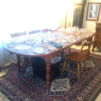Cherry wood dining table with four removable leaves and drop leaves on either end. Also comes with five cherry wood chairs