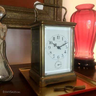 Tiffany and Company brass antique carriage clock made in France. In working condition with original key