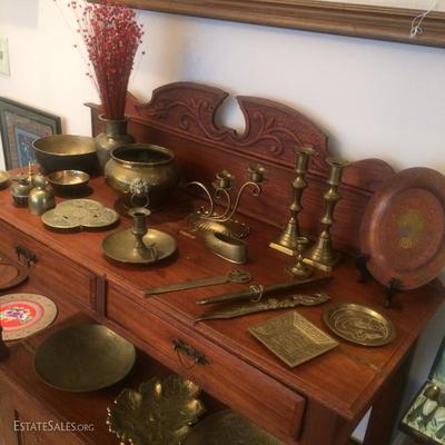 Carved mahogany sideboard with open center area and cupboard doors at the bottom
