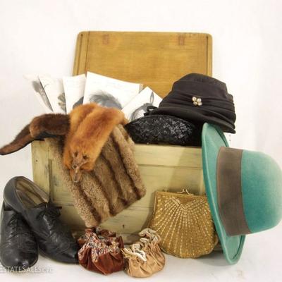 Vintage hats, furs, and accessories all in a nice wood chest. 