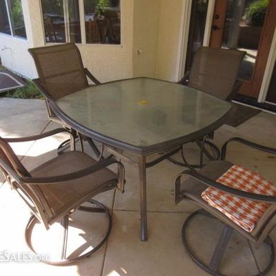 PATIO TABLE WITH GLASS TOP AND MATCHING CHAIRS