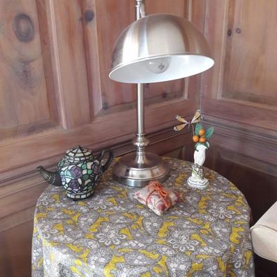 Lighted teapot, vase, tablecloth, hide-a table, scented coasters, reading lamp.
