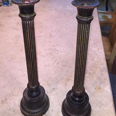 Pair of tall metal candlesticks 