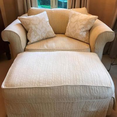 Pair of oversized arm chairs with square ottoman