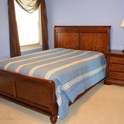 Cresent queen sleigh bed and matching nightstand with outlets