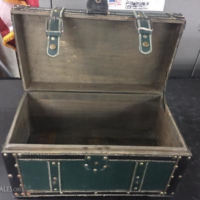 Leather over wood trunk with snap closures