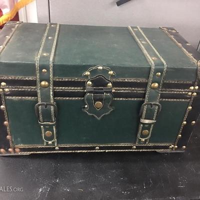 Leather over wood trunk with snap closures