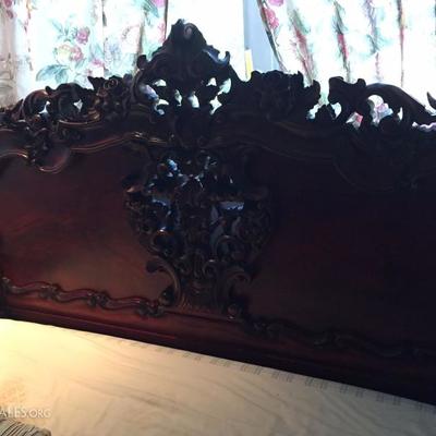 Beautifully engraved wooden bed.