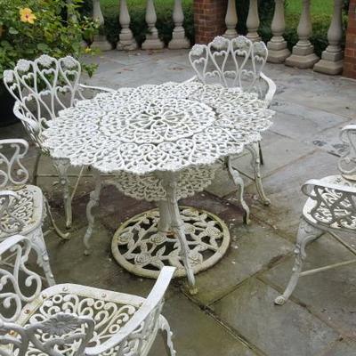 VINTAGE CAST IRONS PATIO TABLES AND CHAIRS (THREE SETS)