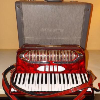 Guerrini Accordion with Hard Case. 120 keys, 3 with glass tops. 2 metal buttons & Clar key, Mast key & Bass key.