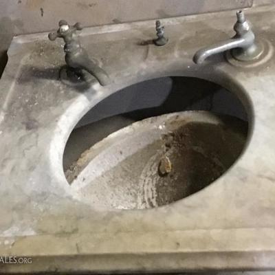 antique marble sink with fixtures 