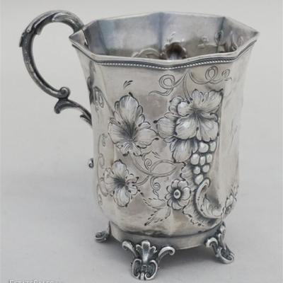 Southern Coin Silver Footed Cup, elaborately decorated paneled body, scroll handle, and feet, grapes, vines and floral repousse...