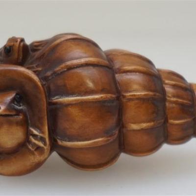 Vintage well carved Japanese Boxwood Frogs on a Shell Netsuke. Signed by the artist